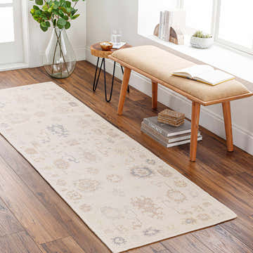 Entryway with Abulug Luxury Handmade Oushak Rug runner, light beige rug with brown and gray pattern, wood bench, and hardwood floors. Roomscene-Runner