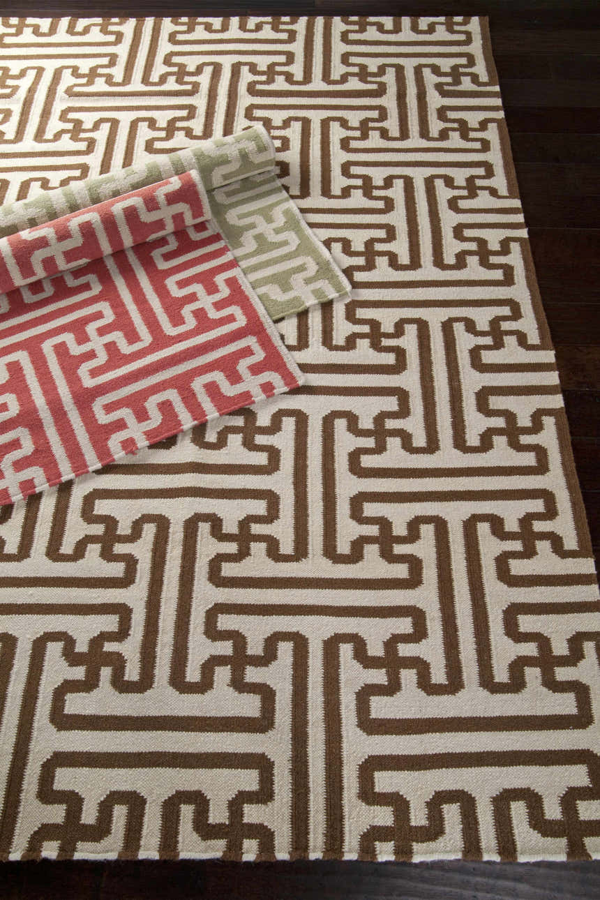 Hand woven Issue Area Rug in light beige and tan with a geometric maze pattern. Wool construction. Styleshot