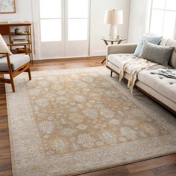 Living room with a beige sofa and Achim Thick Luxe Statement Rug in charcoal, brown, gray, mustard, and tan. Roomscene-Rectangle