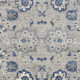 Close-up of the Adairsville Blue Floral Area Carpet, featuring a denim and gray floral pattern on an ivory background. Swatch