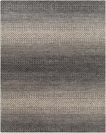Close-up of the hand-knotted Adlay Area Rug. Bohemian style rug in black, charcoal, gray, and oatmeal with a diamond pattern. Design-Rectangle-810