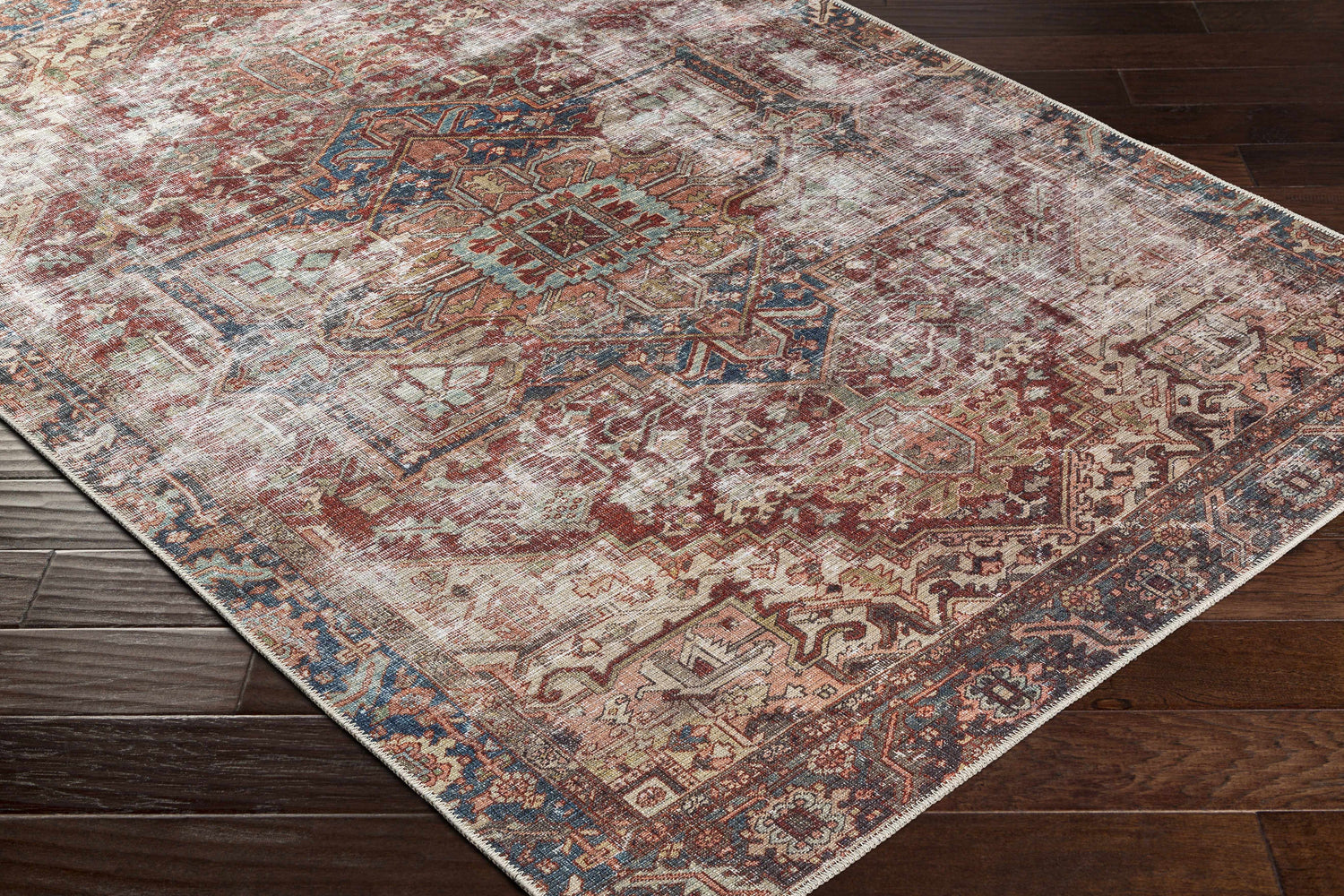 Close-up of the Adtugan Vintage Flat Pile Washable Rug. Features burgundy, gray, and navy tones in a traditional, distressed pattern. Corner