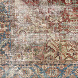 Close-up of the Adtugan Vintage Flat Pile Washable Rug, showcasing its burgundy, blue, and beige oriental pattern and flat weave. Swatch