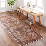 Entryway scene with a burgundy and navy Adtugan Vintage Flat Pile Washable Rug on a wood floor. Bench, side table, and plants. Roomscene-Runner