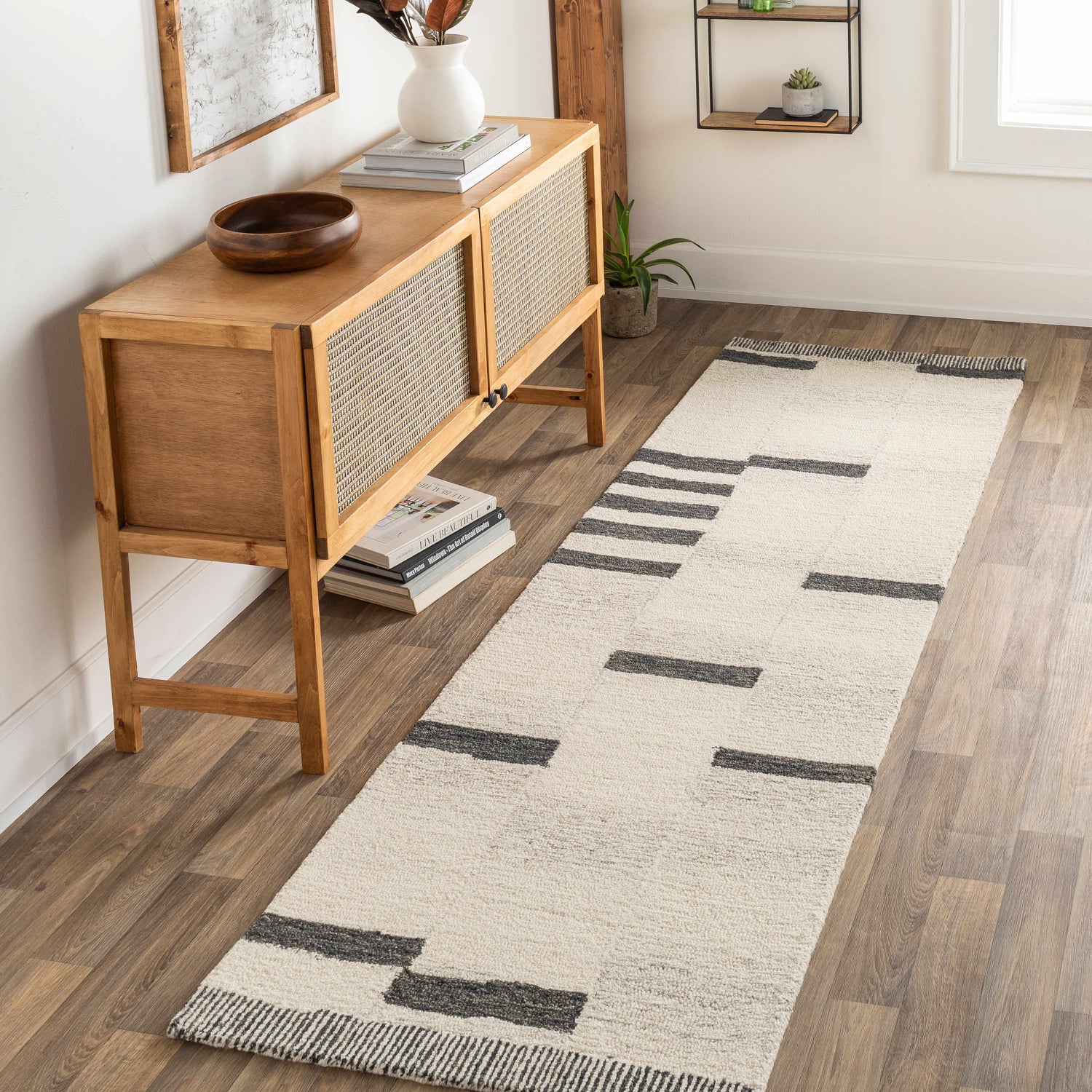 Entryway with wood console table and Aibonito Hand Tufted Wool Area Rug runner in beige and black. Roomscene-Runner