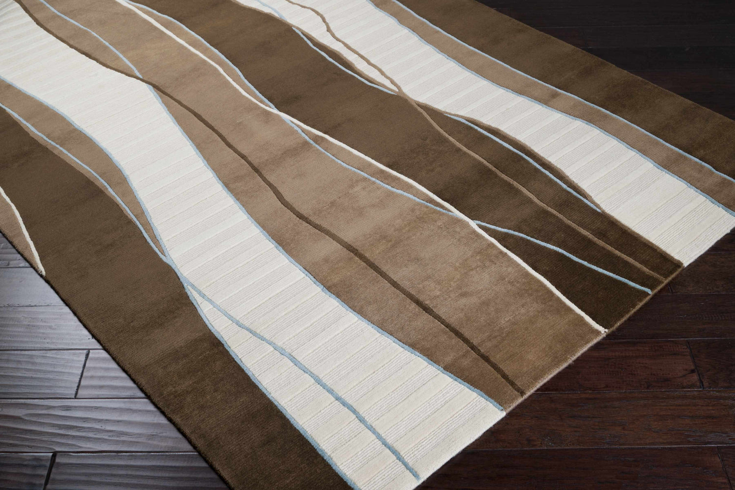 Close-up of the Alanreed Brown Premium Wool Area Rug, featuring dark brown, sage, and cream wavy stripes. Corner