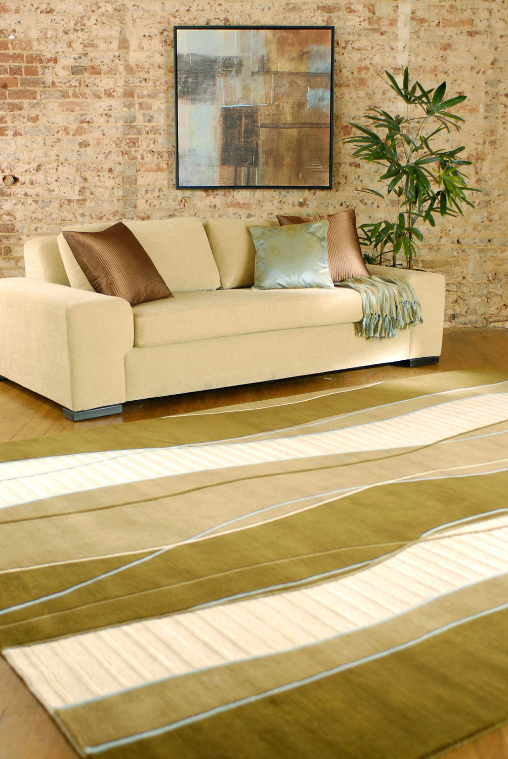 Living room scene with a tan sofa and the Alanreed Brown Premium Wool Area Rug in dark brown and sage. Roomscene-Rectangle