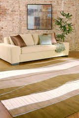 Living room scene with a beige sofa and the Alanreed Brown Premium Wool Area Rug. Roomscene-Rectangle