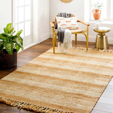 Light beige and tan striped Alara Area Rug in a bright, airy living room with jute chair and wood floors. Roomscene-Rectangle