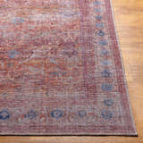 Close-up of the Alcoy Washable Area Rug showcasing its dark purple, brown, and pink oriental design and machine woven texture. Front
