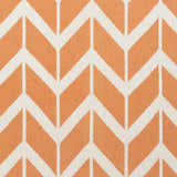 Close-up of the Amalia Area Rug. Cream and orange wool rug with a geometric chevron pattern. Hand woven texture. Swatch