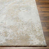 Close-up of the Ambra Thick Luxe Boutique Rug showing its gray, light brown, and white contemporary pattern. Front