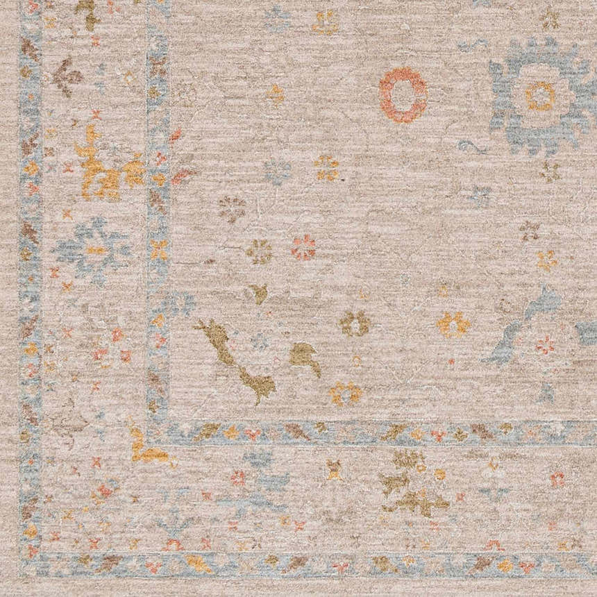 Close-up of the Amina Oushak rug, showing its traditional design, amber, dusty pink, light olive, and medium gray colors. Swatch