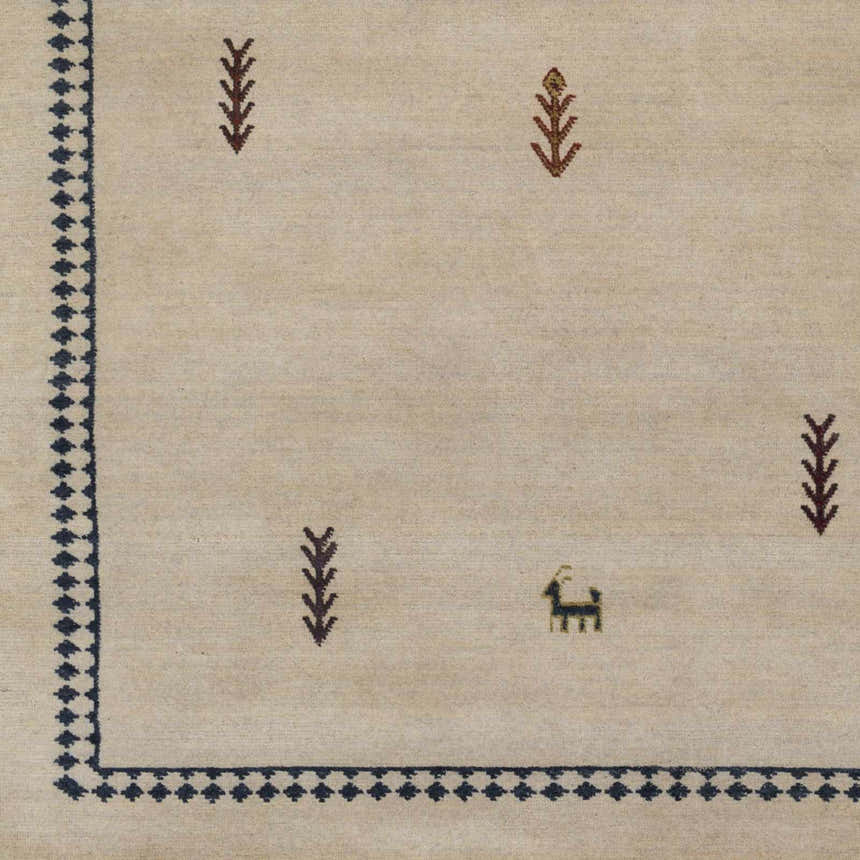 Close-up of the Anstruther Area Rug. Hand-knotted wool rug with dark brown, olive, and wheat geometric and animal motifs. Swatch