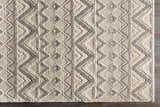 Close-up of the hand woven Whittington Gray&Cream Wool Rug. Features a geometric diamond pattern and textured wool. Swatch