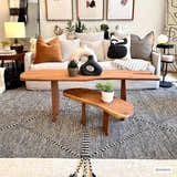 Bohemian living room with a Spottswood Area Rug, wood coffee table, and cream sofa with decorative pillows. Roomscene-Rectangle