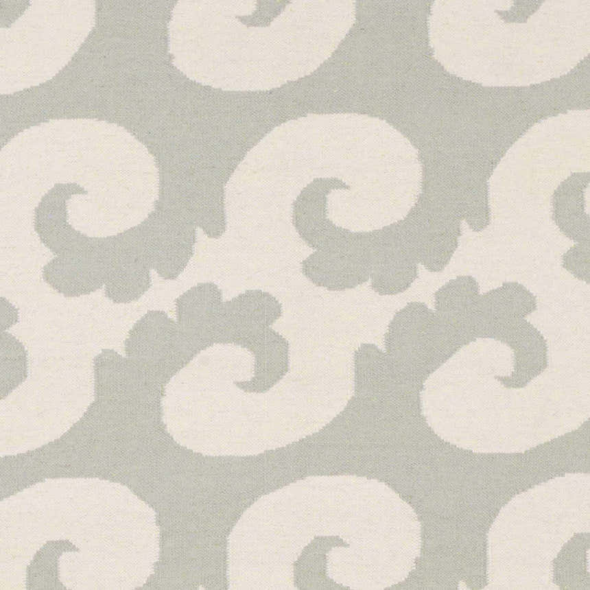 Close-up of the Arkoma Area Rug, showcasing its ivory swirls on a dusty sage background. Swatch