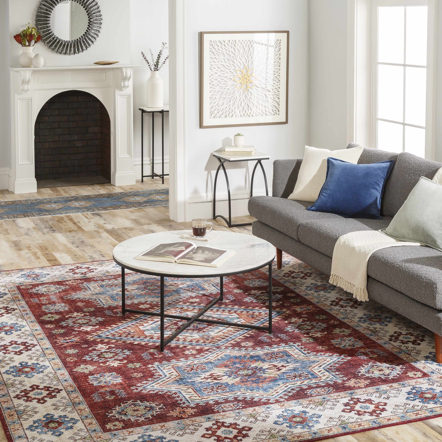 Living room with gray sofa and Armadale Clearance Rug in red, blue, and beige bohemian pattern. Roomscene-Rectangle
