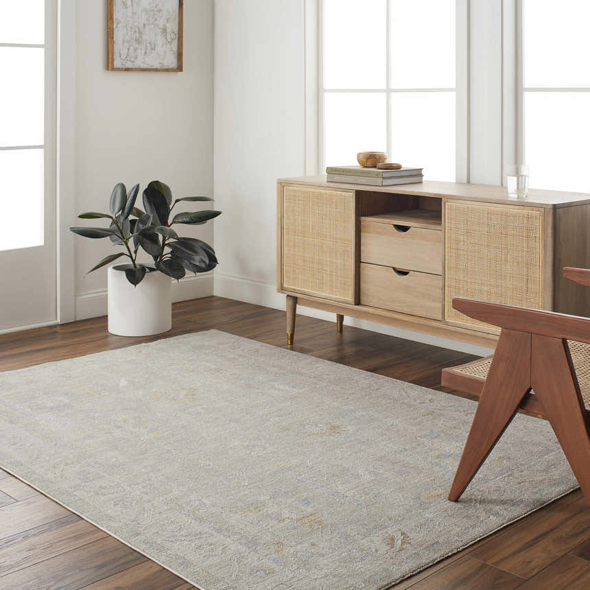 Living room scene with a Cloud Gray Ashra Thick Luxe Area Rug, wood floors, and a natural wood cabinet. Roomscene-Rectangle