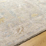 Close-up of Ashra Thick Luxe Area Rug showing texture, pile, and neutral colors like gray, brown, and lambswool. Texture