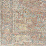 Close-up of the hand woven Atulayan Premium Rug with a traditional pattern in blue, burgundy, and light gray. Swatch