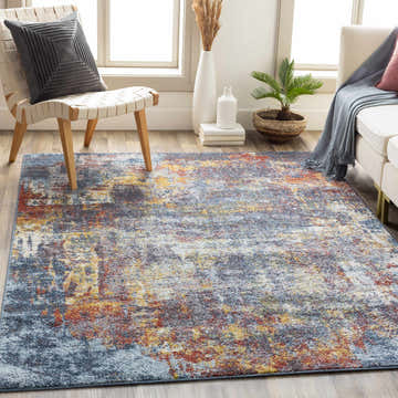Living room scene with the Auckley Colorful Abstract Area Rug, featuring brick red, charcoal, cream, and blue tones. Roomscene-Rectangle