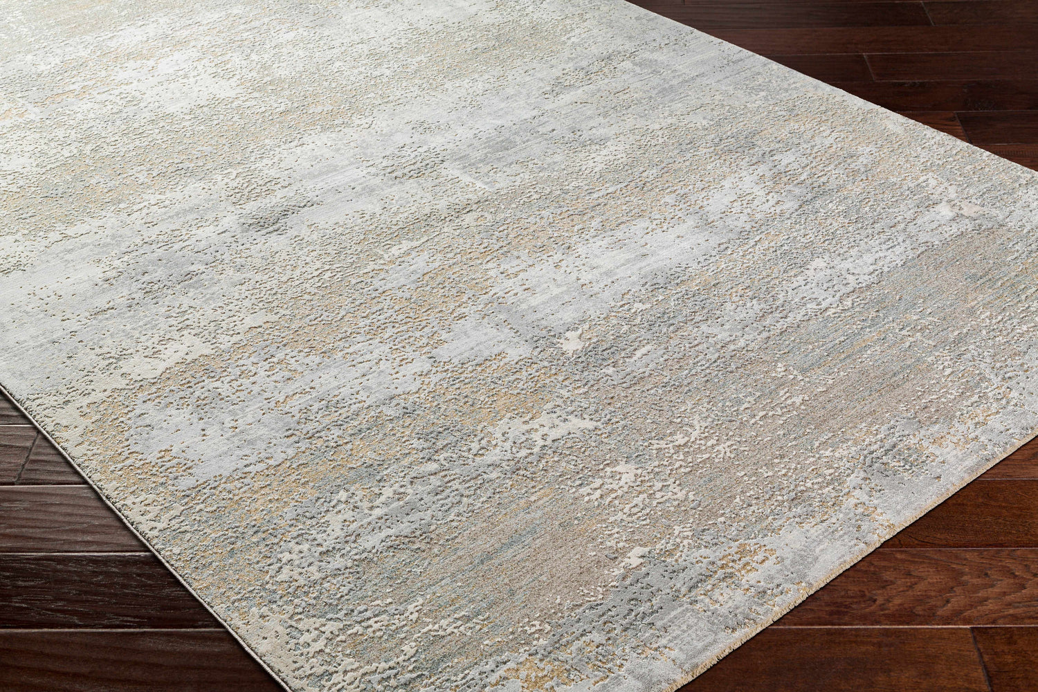 Close-up of the Avani Thick Luxe Boutique Rug, showcasing its gray, nutmeg, and white contemporary design and textured weave. Corner