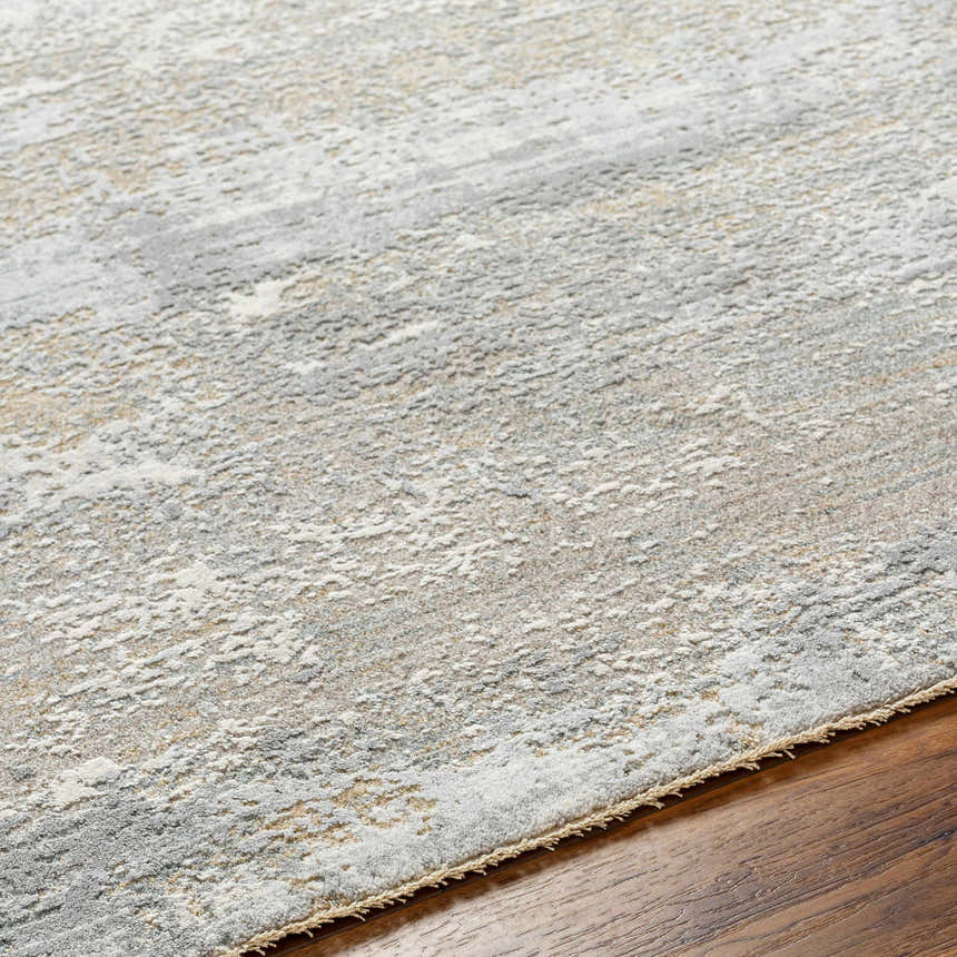 Close-up of the Avani Thick Luxe Boutique Rug showing its gray, white, and nutmeg abstract pattern and plush texture. Texture