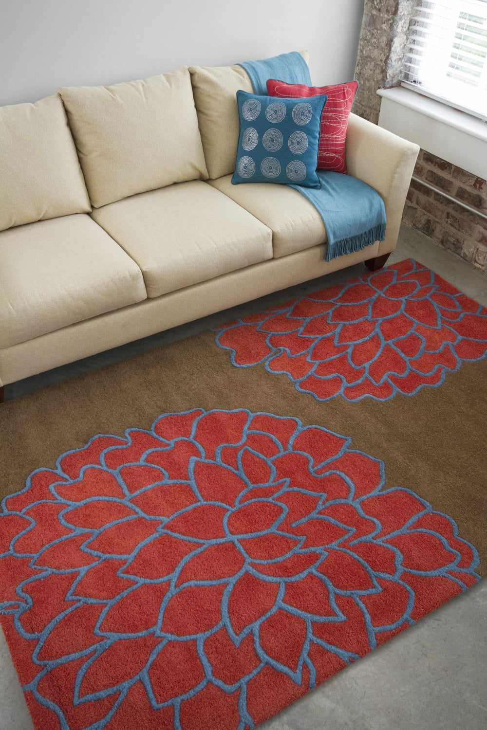 Living room scene with a beige sofa and the Avella Area Rug in brown with large burgundy and blue floral pattern. Roomscene-Rectangle