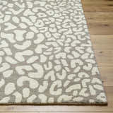 Close-up of the beige and gray Azuka Leopard Print Area Rug, a hand-tufted wool rug with a contemporary animal print pattern. Front