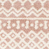 Close-up of the Azura Shag Area Rug showing its geometric pattern, shag texture, and colors: dusty pink, white thatch, and dark beige. Swatch
