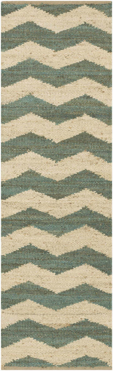 Close-up of the Brook Jute Rug. Hand-woven rug with a beige and light green chevron pattern. Farmhouse style. Design-Runner