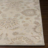 Close-up of the hand-tufted Conesus 1192 Ivory & Taupe Wool Rug. Features a traditional floral pattern in ivory, tan, and taupe. Front