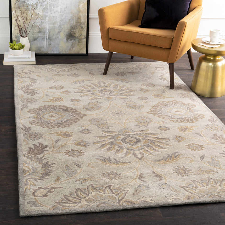 Living room scene with a Conesus 1192 ivory and taupe wool rug, mustard chair, and gold side table. Roomscene-Rectangle
