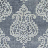 Close-up of the Bargersville Area Carpet. Hand-knotted wool rug in blue and pale blue with a traditional damask pattern. Swatch
