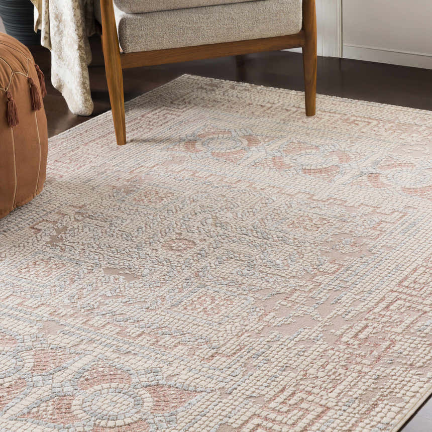 Living room scene with Terlingua Blush Greek Mosaic Carpet, tan chair, and brown pouf. Bohemian style rug. Roomscene-Rectangle