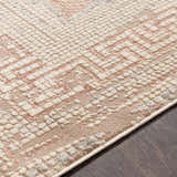 Close-up of the Terlingua Blush Greek Mosaic Carpet showing a textured, geometric design in blush, tan, and slate. Texture