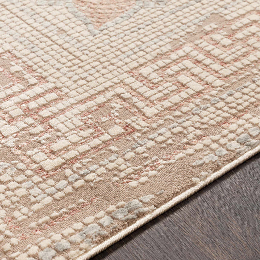 Close-up of the Terlingua Blush Greek Mosaic Carpet showing a textured, geometric design in blush, tan, and slate. Texture