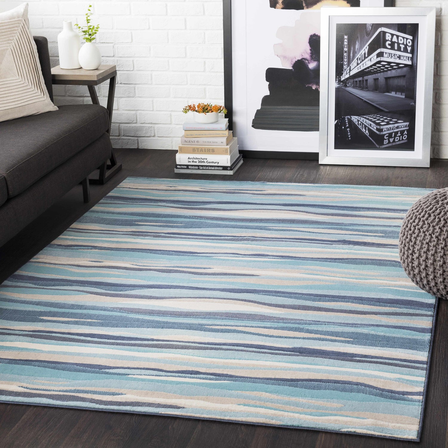 Living room scene with blue striped Basco Area Rug, gray sofa, and modern decor. Roomscene-Rectangle