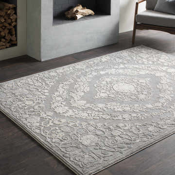 Living room scene with a beige and charcoal Battleview Updated Traditional Tibetan Rug. Roomscene-Rectangle