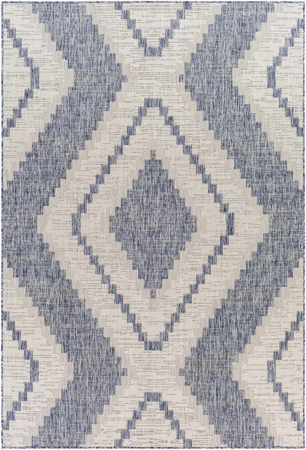Close-up of McCrory Pale Blue Flat Rug. Geometric diamond pattern in pale blue, navy, and off-white. Machine woven texture. Design-Rectangle-537