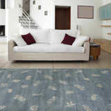 Living room scene with a blue Beach Area Carpet, white sofa, and modern decor. Roomscene-Rectangle