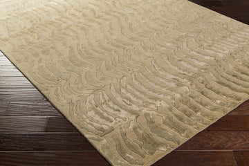 Close-up of the Belgrade Area Carpet in beige and camel, featuring a contemporary, wavy pattern and textured wool. Corner