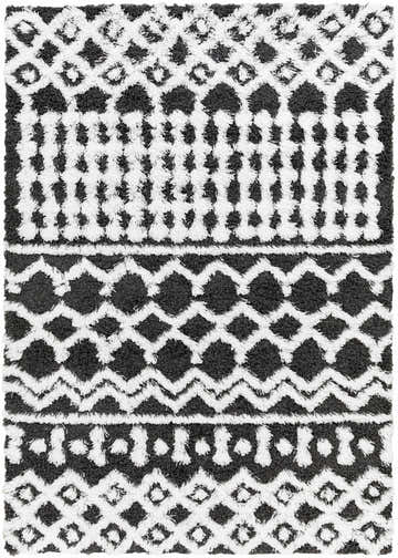 Close-up of the Bente Shag Area Rug; dark gray and white geometric pattern, shaggy texture. Design-Rectangle-5373