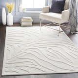 Living room scene with a light beige Benzonia 3D White Zebra Rug, chair, and decor. Roomscene-Rectangle
