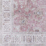 Close-up of the Bergman Distressed Red Area Rug, showcasing its blush, cream, and mauve floral pattern and traditional design. Swatch