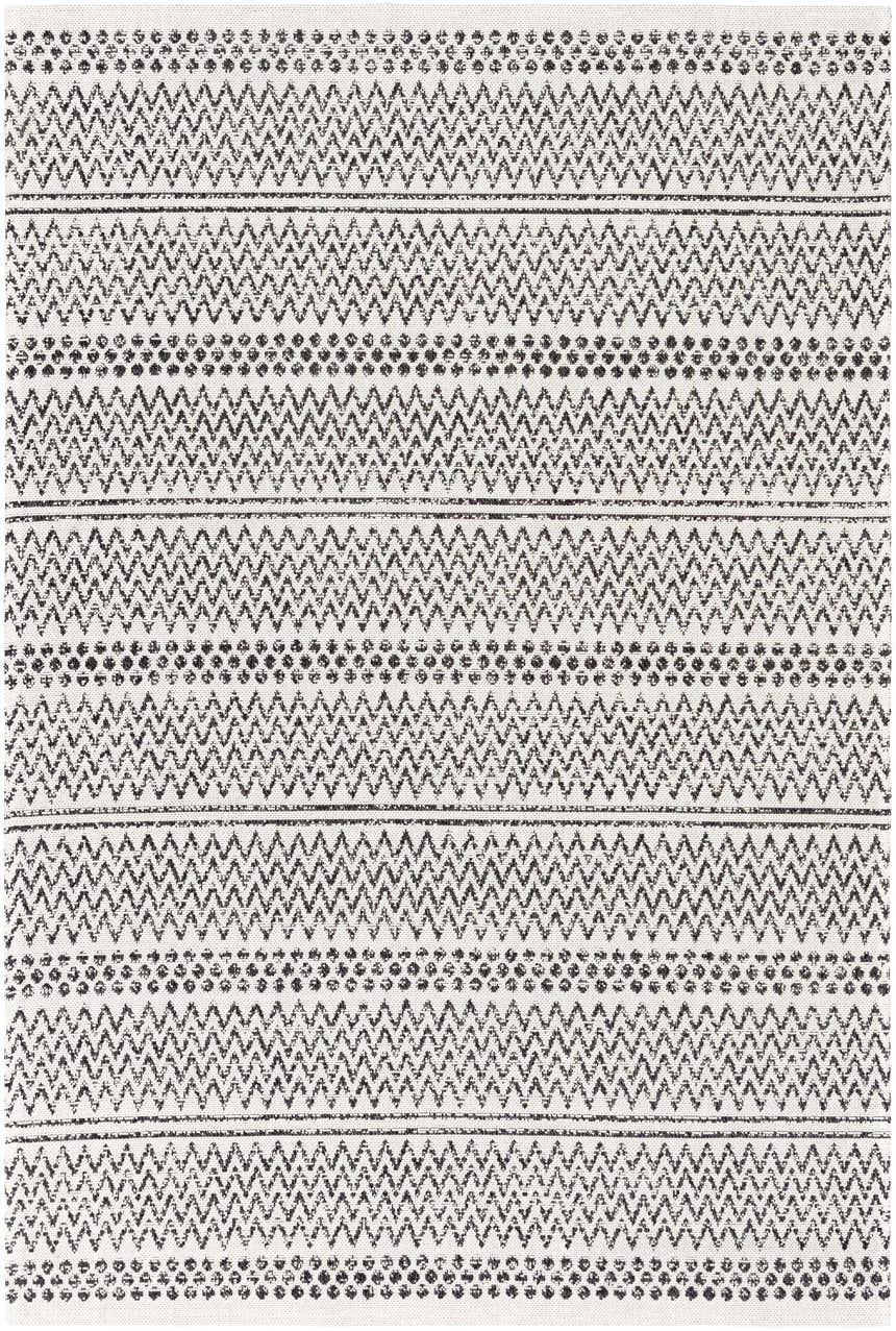 Close-up of Bewbush Washable Area Rug. Black and cream cotton rug with a bohemian-inspired zigzag and dotted pattern. Design-Rectangle-5373