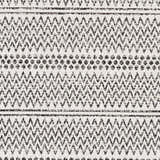 Close-up of the Bewbush Washable Area Rug. Black geometric patterns on cream cotton. Bohemian farmhouse style rug texture. Swatch