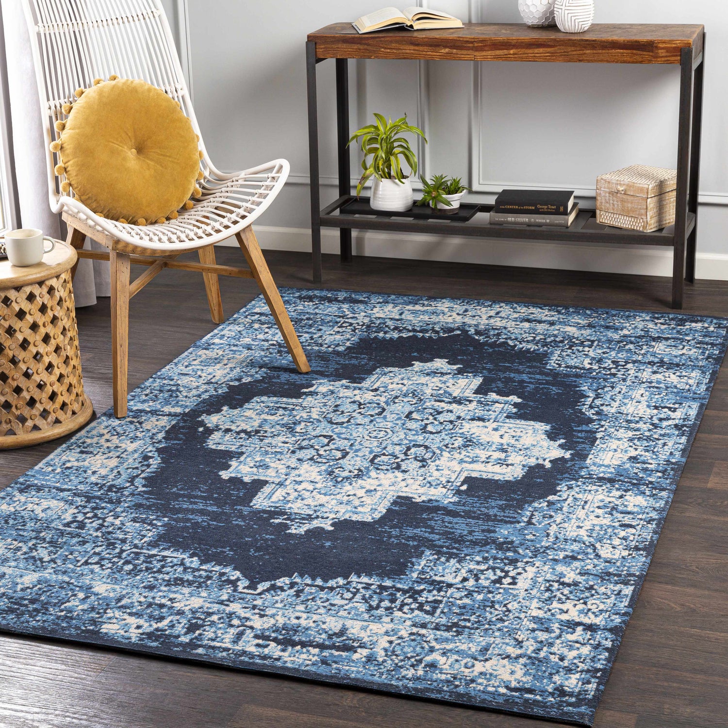 Farmhouse-style room with blue Bleadon Carpet, white chair, and wooden console table. Roomscene-Rectangle
