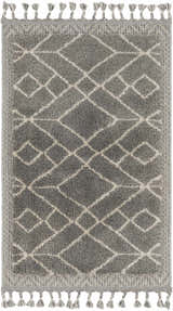 Close-up of the Ballybunnion Area Rug. Charcoal rug with light beige geometric diamond pattern and decorative tassels. Design-Rectangle-23